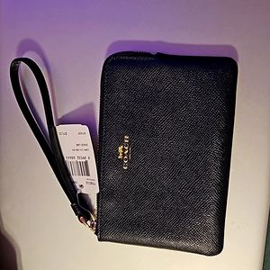 Black coach wristlet, leather material